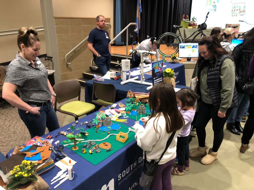 Dr. Pritchard observes children working on park design elements.